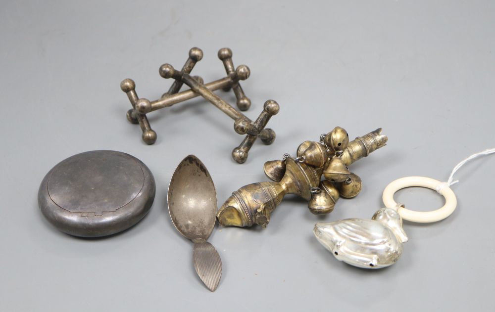 Mixed silver including a Georgian silver gilt childs rattle (lacking teether), a later rattle, a Dutch white metal caddy spoon, etc.